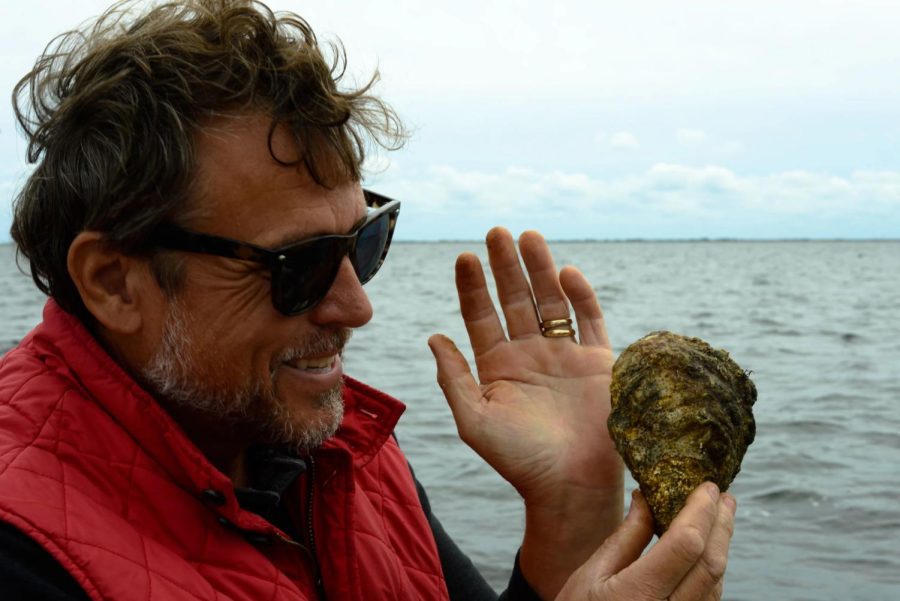 Tom Schultz, director of restoration at Friends of Bellport Bay, leads a shellfish management area to protect young oysters from harvesting.