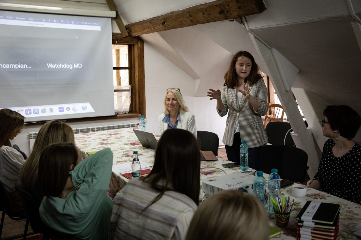 Ecaterina Miscisina, media content manager for WatchDog (center right), trains Moldovan journalists to combat disinformation. 