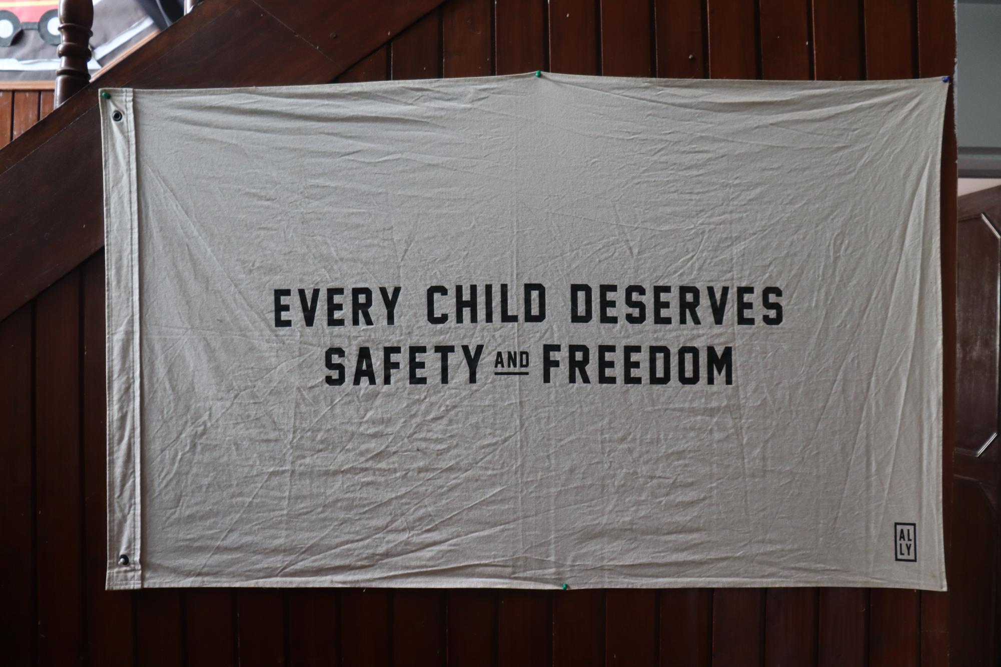 A banner hanging on one of  the walls of the school run by Nepalese Home in Kathmandu. Photo by Rafael Cruvinel. 