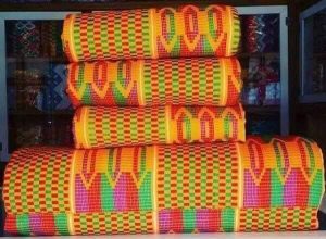 A collection of beautifully patterned Kente cloth.